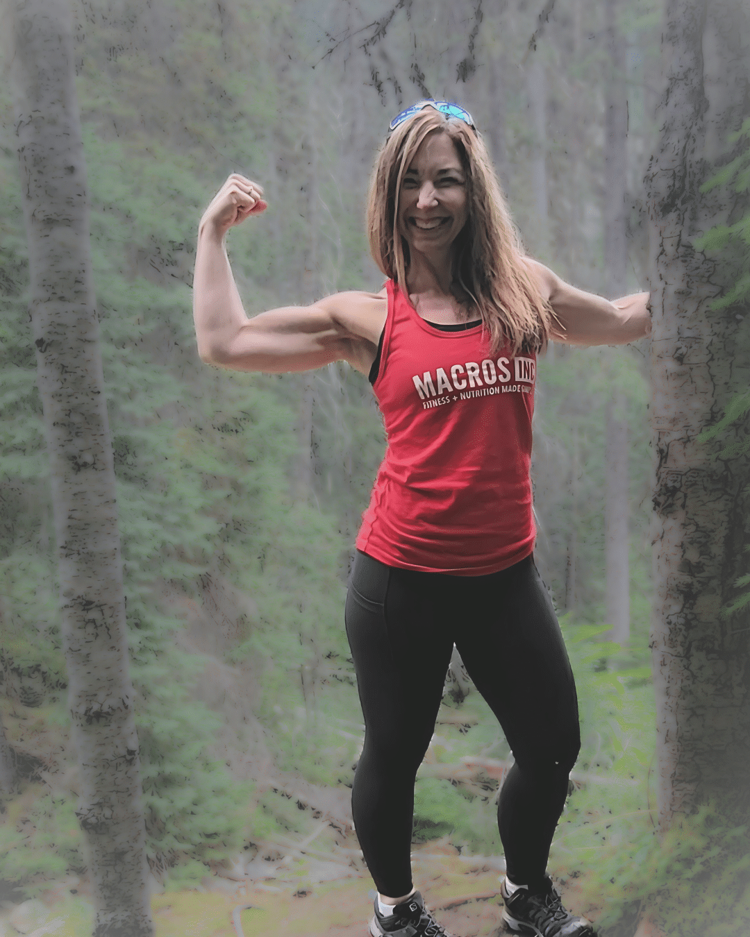 Woman performing deadlift exercise with barbell - personalized fitness coaching